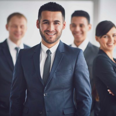 confident-business-team-with-leader-min