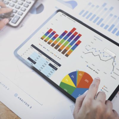 businesswoman-using-tablet-analysis-graph-company-finance-strategy-statistics-success-concept-planning-future-office-room-min
